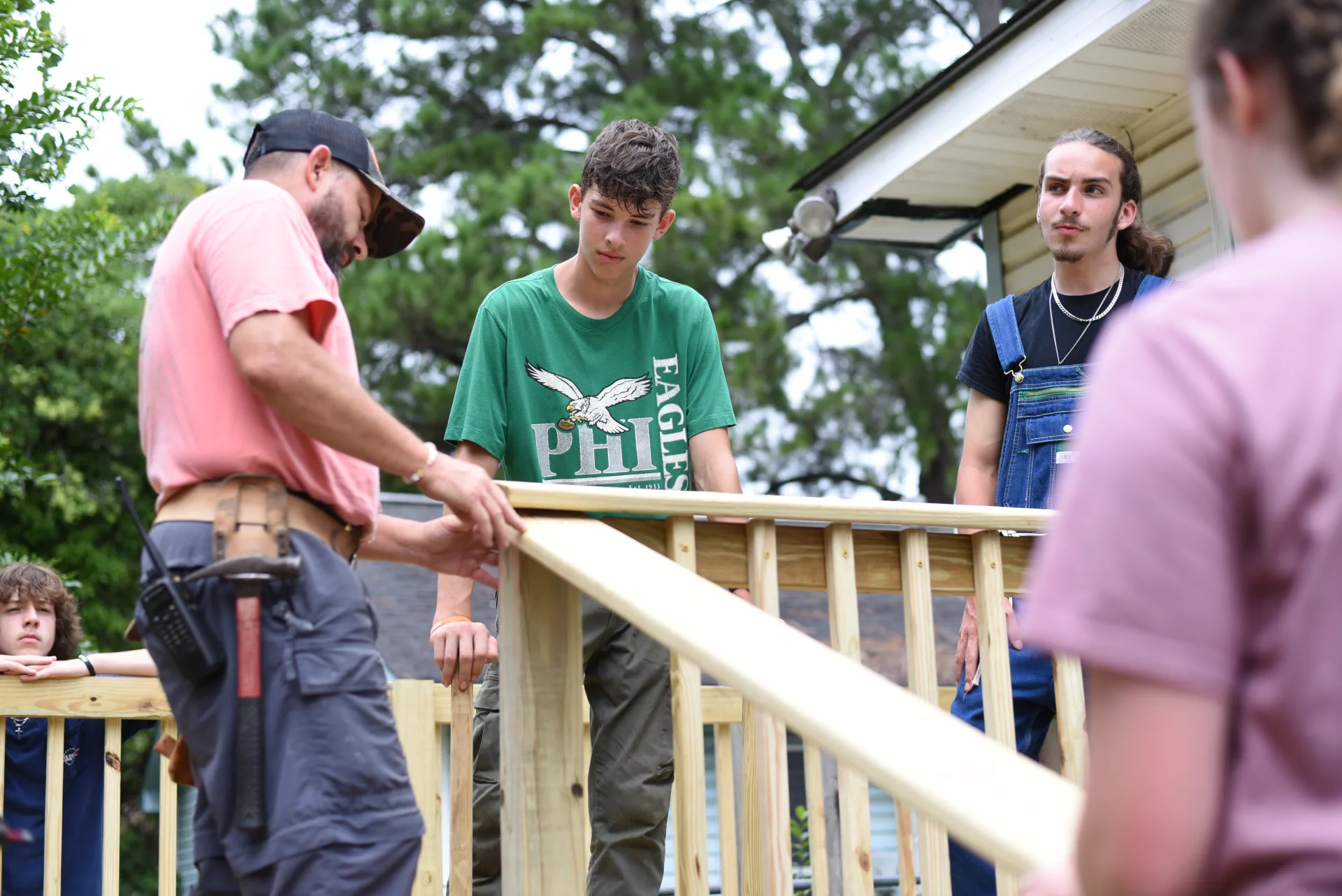 Leader teaching students on site