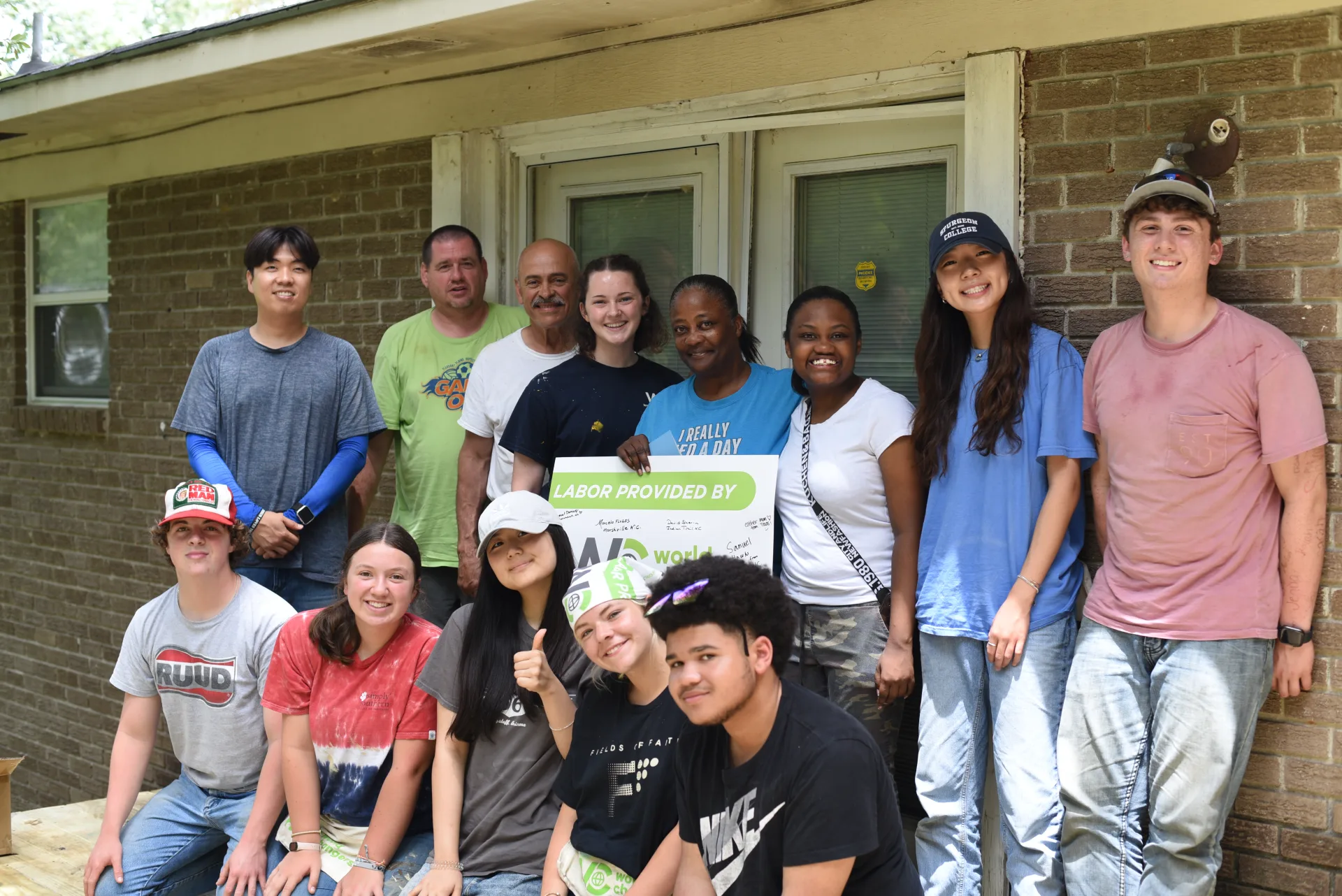 Crew with homeowners after completing project