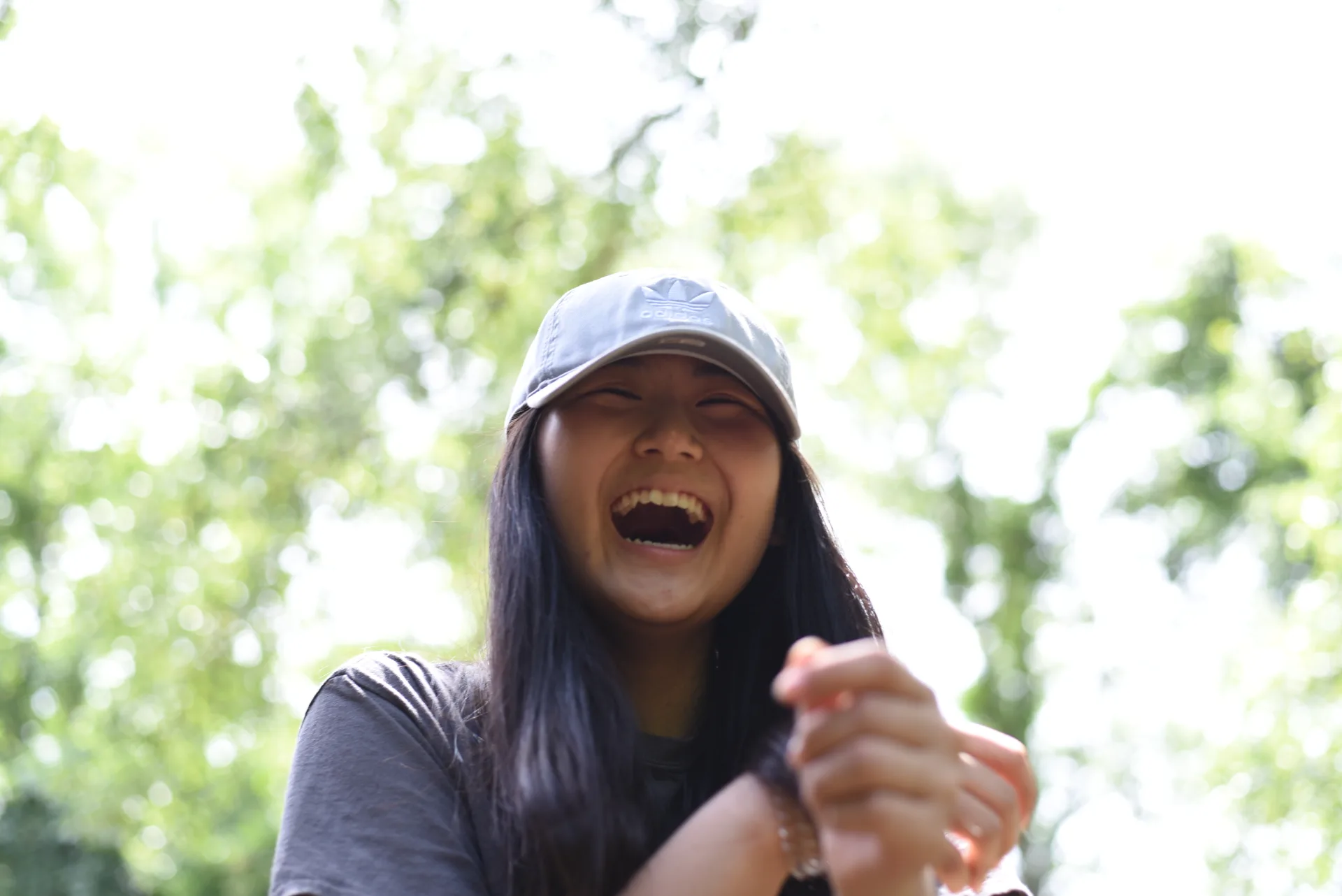 Student laughing in natural setting
